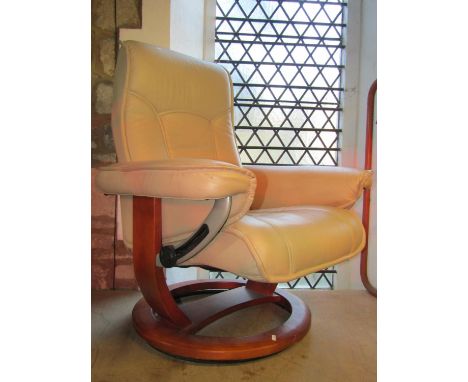An Ekornes Stressless adjustable lounge chair with soft stitched cream leather upholstery raised on open ring shaped platform