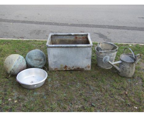 A galvanised trough of rectangular form with tubular rim, 64cm long x 50cm wide x 42cm high, together with further galvanised