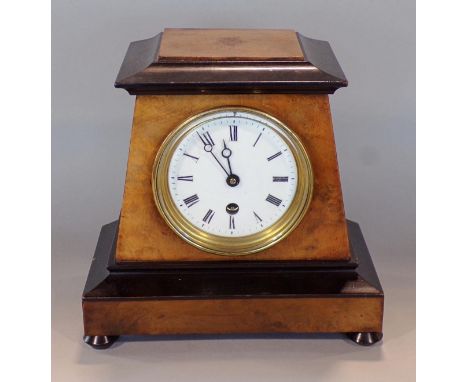 Regency walnut and ebonised tapered sarcophagus mantel clock, the enamelled dial with Roman numerals and single train drum he