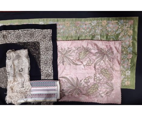 Collection of interesting Eastern textiles including a lined green silk table runner embroidered with floral patterns in sati