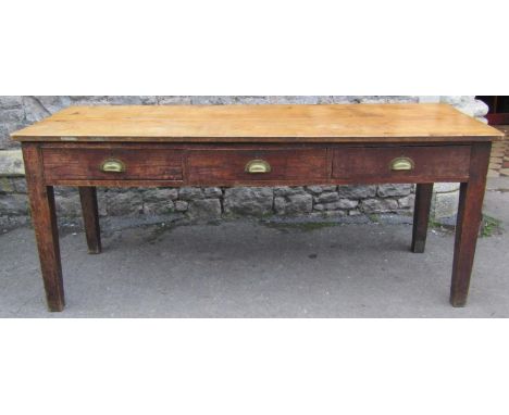 A vintage oak ex school table fitted with three frieze drawers raised on square cut and slightly tapered supports, a fruitwoo