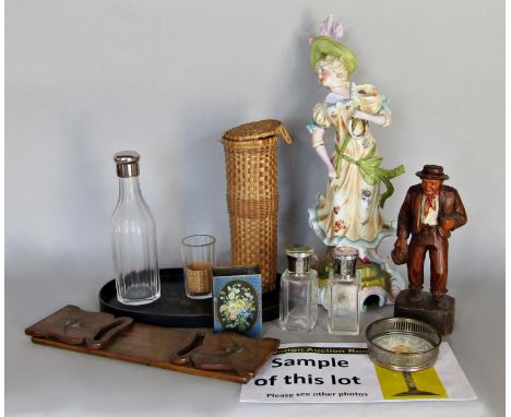 A miscellaneous collection of items, a china figure of a woman, carved wooden figure of an old man, lacquered tray an oval mi