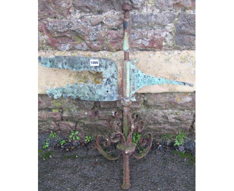 An antique reclaimed wrought iron weather vane with weathered verdigris copper pointer and scroll work detail (AF), 72 cm hig