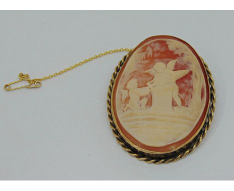 Vintage 9ct cameo brooch depicting playful Putti in a garden, 5.3cm L approx, 18.8g 