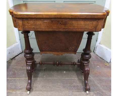 A good quality Victorian burr walnut games/sewing table, the shaped top with floral marquetry inlay, enclosing a chequer boar