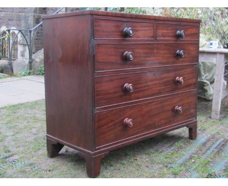 A 19th century mahogany bedroom chest of two short over three long graduated drawers with turned handles and mother-of-pearl 