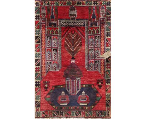 Persian old Baluchi village rug with architectural decoration upon  deep red ground, 130 x 85cm 