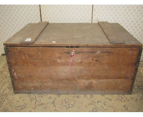 A vintage rustic stained pine box with hinged lid and drop ironwork carrying handles, 81cm wide x 54cm deep x 38cm high 