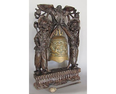 A Chinese temple gong, hardwood carved figural gong bearers with fine silver metal decoration, 46 cm high 