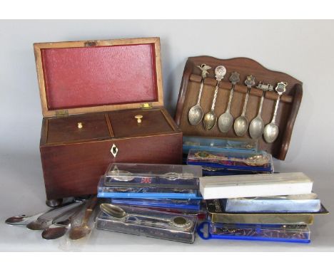 A Georgian mahogany tea caddy and a quantity of commemorative teaspoons 