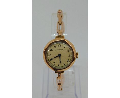 Vintage 9ct Renown dress watch with textured sunburst dial and Arabic numerals, 26mm case, upon a 9ct concertina bracelet, 19