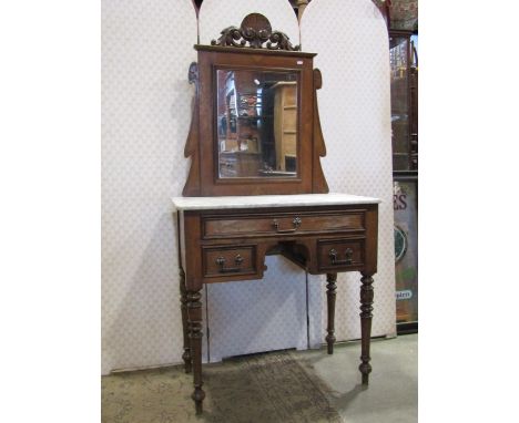 A 19th century walnut dressing table, the raised swing mirror back with rectangular plate beneath a scrolling acanthus and sh