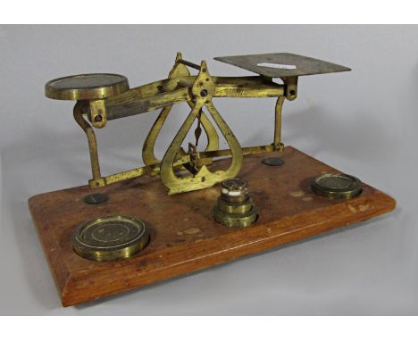 A brass set of stationery scales and weights 