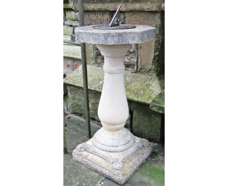 A reclaimed two sectional sundial, with square stepped base and vase shaped pedestal supporting an octagonal top, with circul