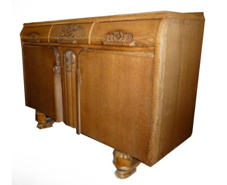 CARVED LIGHT OAK ENCLOSED SIDEBOARD AND A PAIR OF LATH BACK DINING CHAIRS WITH SPIRAL FRONT LEGS (3) 