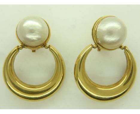 A pair of 18ct gold crescent earrings, each set with a large domed circular baroque pearl, drop L: 45 mm, combined 21.6g. UK 