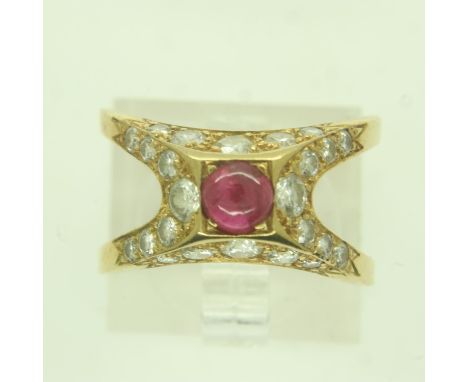A continental 18ct gold ring, pyramidal setting with a cabochon ruby and diamond-set shoulders, split-shank, size N/O, 4.7g. 