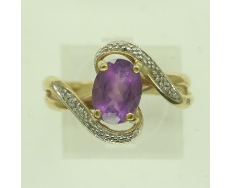 9ct gold amethyst and diamond crossover ring, size P, 3.4g. UK P&amp;P Group 0 (£6+VAT for the first lot and £1+VAT for subse