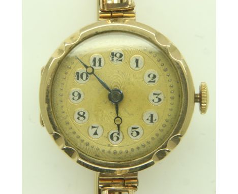 9ct gold ladies wristwatch, on a 9ct gold expanding bracelet. UK P&amp;P Group 1 (£16+VAT for the first lot and £2+VAT for su