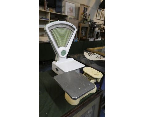 A Set of Double Facing Shop Scales by the Leicester Scale Company and a Cream Enamelled Kitchen Scale 