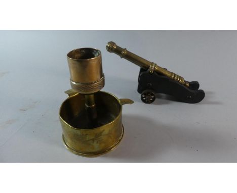 A Brass Mounted Model of a Ships Cannon Together with a Trench Art Shell Base Converted to Match Holder and Striker 