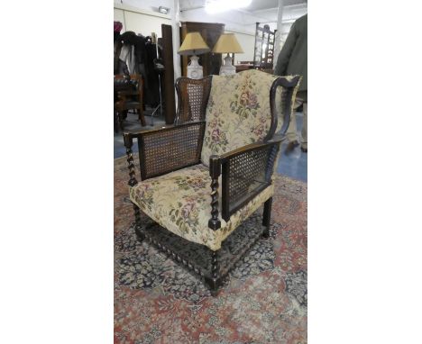 A Tapestry Upholstered Barley Twist Wing Armchair with Caned Panels, In Need of Attention 