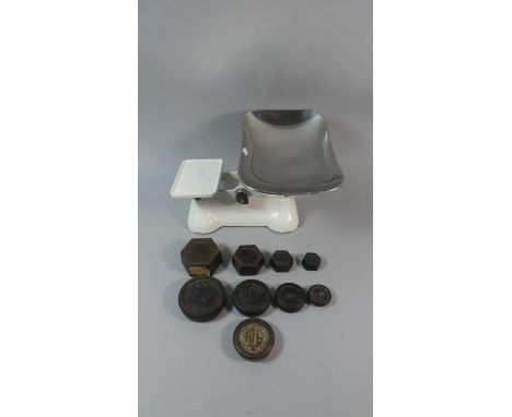 A Set of White Painted Kitchen Scales and Weights 