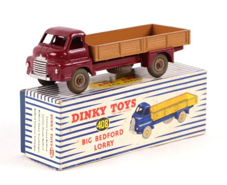 A Dinky Toys no. 408 big Bedford lorry, maroon cab with light tan flatbed and cream hubs, boxed.Condition ReportThe original 