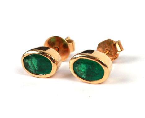 A pair of 18ct gold emerald set stud earrings.Condition ReportEmeralds are approx 5mm by 8mm