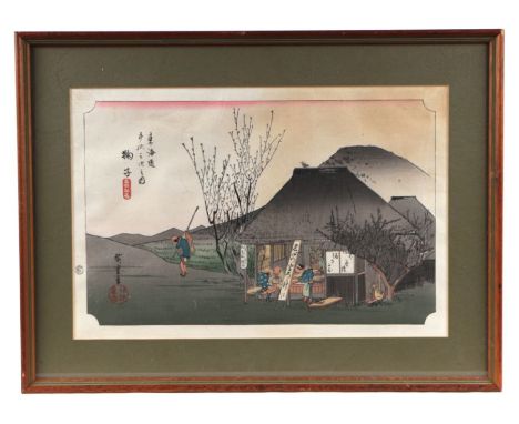 A Japanese coloured print depicting figures in a landscape, 38 by 25cms.