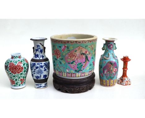 A Chinese famille rose planter on stand decorated with phoenix within panels, red seal mark to the underside (heavily restore