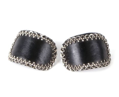 A pair of George III Boultons &amp; Smith's shoe buckles, constructed of a plain leather front with silver border and steel b