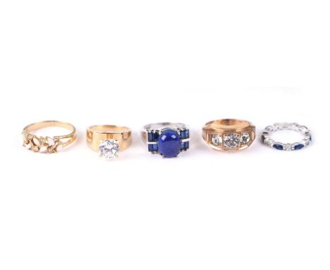 A group of five dress rings.Condition ReportThe rings are costume and not gold.