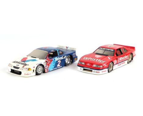 A GMP 1/18 scale Ford Mustang Cobra in Valvoline Racing Livery and another similar in Whistler Radar Detectors Race (2).