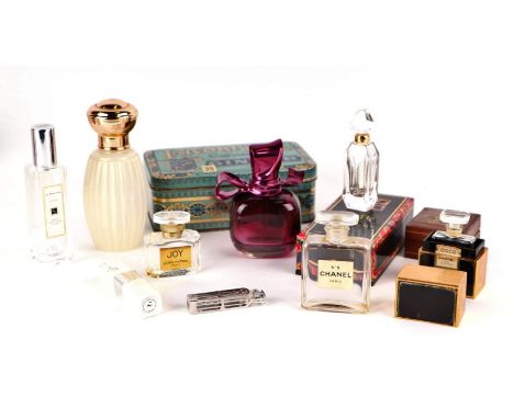 A vintage boxed Coco Chanel perfume bottle; together with a Chanel No.5 perfume bottle; and other perfume bottles.