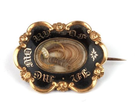 A 19th century yellow metal black enamel and hairwork mourning brooch, 3 by 2.2cms, 5.8g.