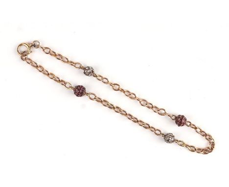 A yellow metal (test as 9ct gold) chain bracelet the links interspersed with ruby and diamond set balls. 5.8g