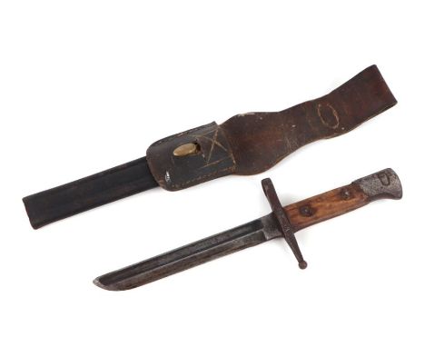 A WW1 trench knife made from a cut down Italian model 1891 knife bayonet in its leather scabbard with brass mount. Marked TER