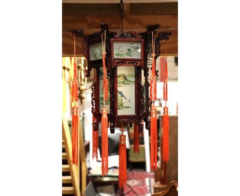 A Chinese hanging lantern with painted panels. 42cm wide