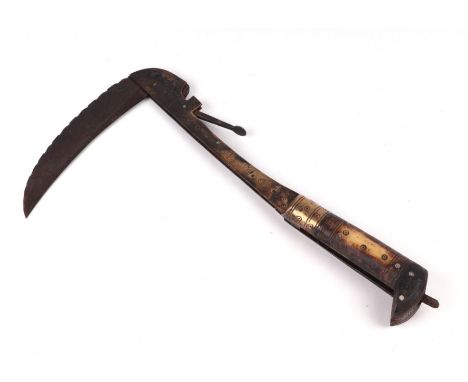 An Afghan Lahore folding axe with bone handle, 30cms long.Condition ReportThe axe blade does open and locks correctly, the ca