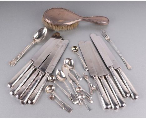 A set of ten silver handled knives, Sheffield 1927; together with a silver backed hairbrush and a quantity of silver flatware