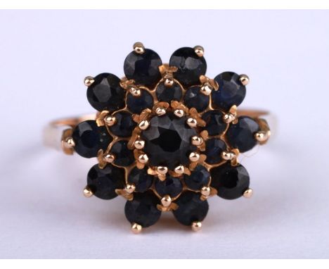 A 9ct gold sapphire cluster ring, approx UK size 'O', 3.1g.