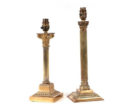 An Adams style cast brass Corinthian column table lamp, 33cms high; together with a similar example, 28cms high (2).