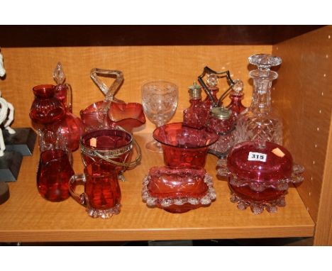 VARIOUS RUBY COLOURED GLASS, to include basket, jugs, bowls, four bottled cruet stand etc, together with a cut glass decanter