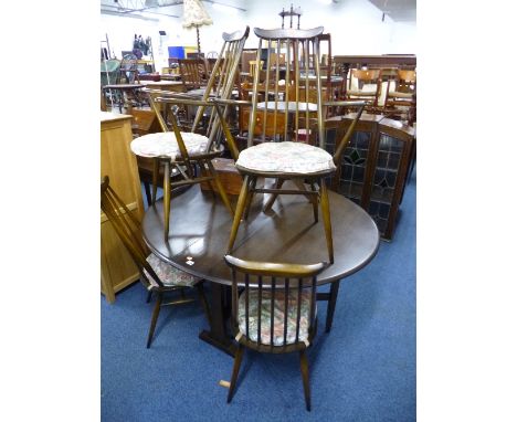 AN 'ERCOL' DARKWOOD DROP LEAF TABLE, approximate size length 140cm x width 128cm x height 72cm and four spindle back chairs i
