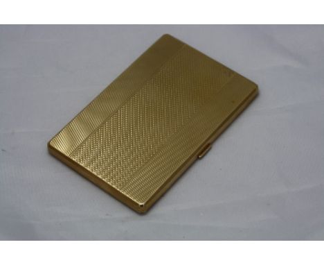 A 9CT GOLD CIGARETTE CASE, having engine turned triptych detailing opening to gilt interior, Birmingham Adie Bros, approximat