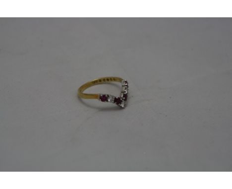 AN 18CT SEVEN STONE DIAMOND AND RUBY WISHBONE RING, ring size P, approximate weight 3.0 grams