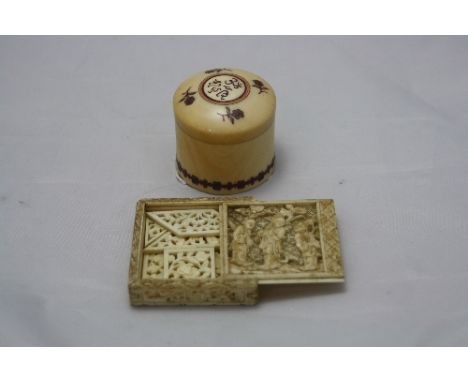 A SMALL CARVED 19TH CENTURY IVORY BOX, with sliding lid containing seven carved and pierced ivory panels as a puzzle, togethe