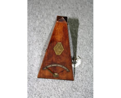 A MAHOGANY CASED METRONOME, with panel inscribed Metronome de Maelzel, approximately 23.5cm high 