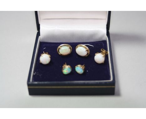 THREE PAIRS OF OPAL EARRINGS, set in yellow metal